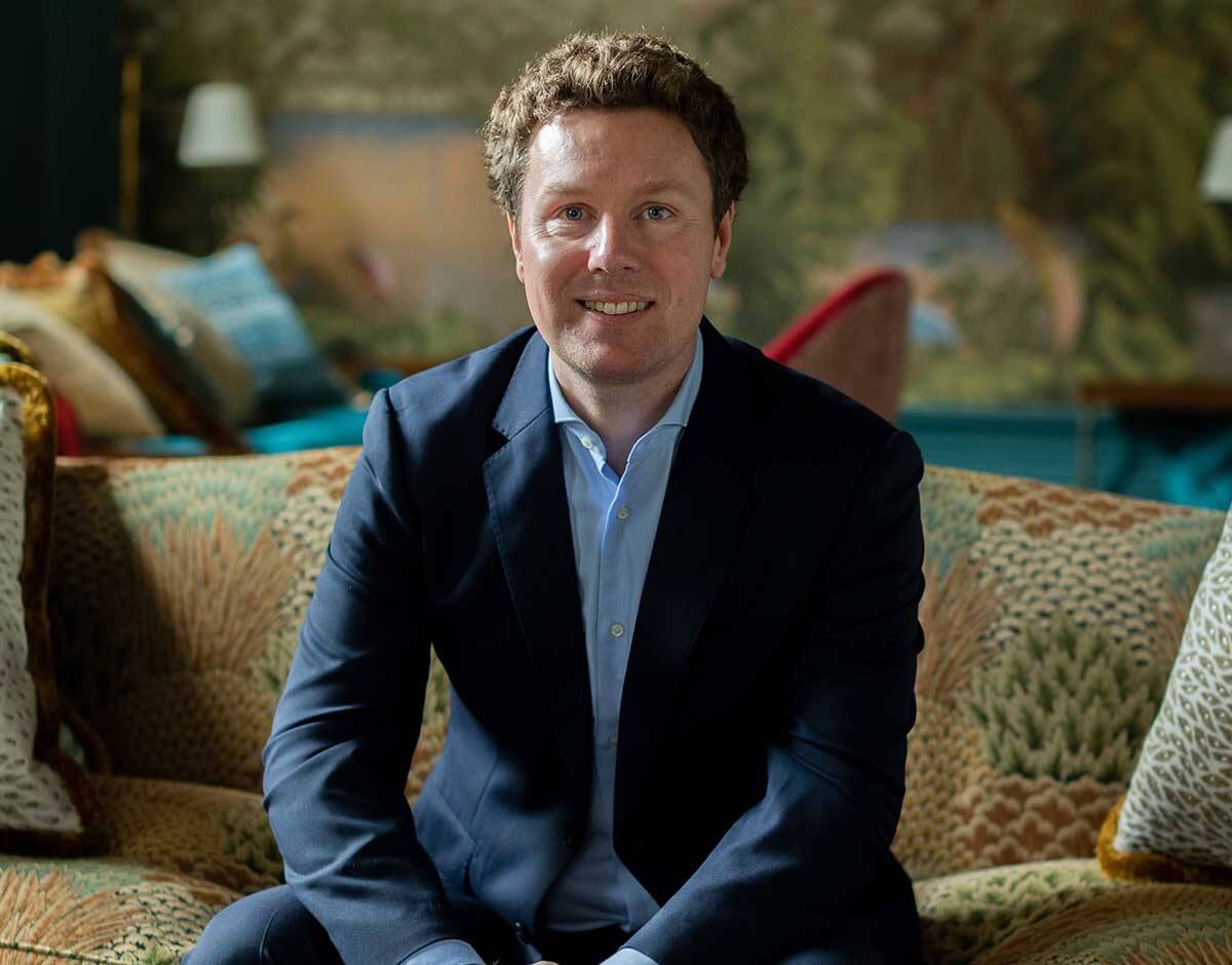 Jonathane Dunne smiling at his clinic in Belgravia