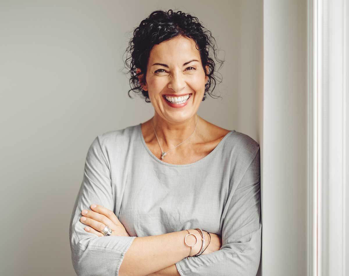 Woman smiling after treatment with Jonathan Dunne