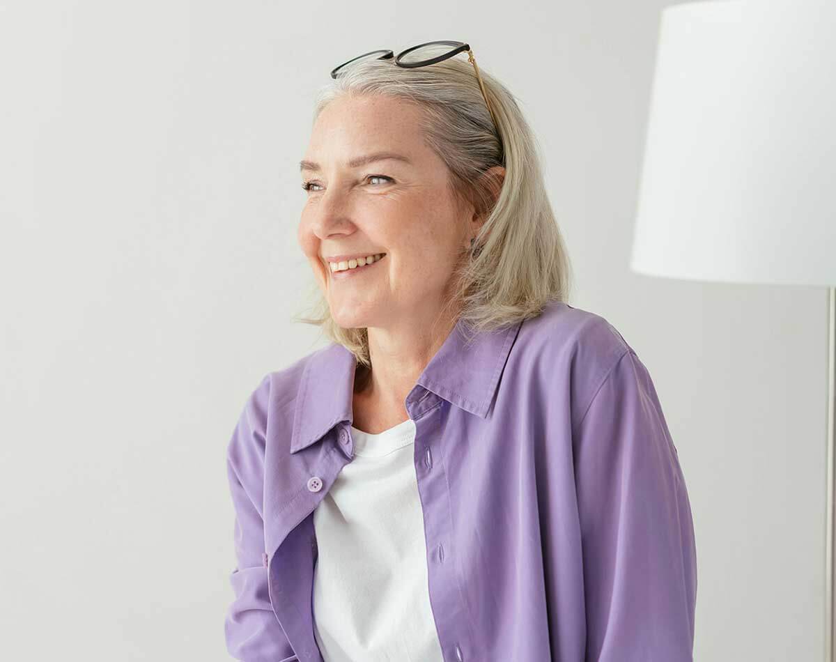 Woman smiling after a successful surgery in Belgravia with Jonathan Dunne