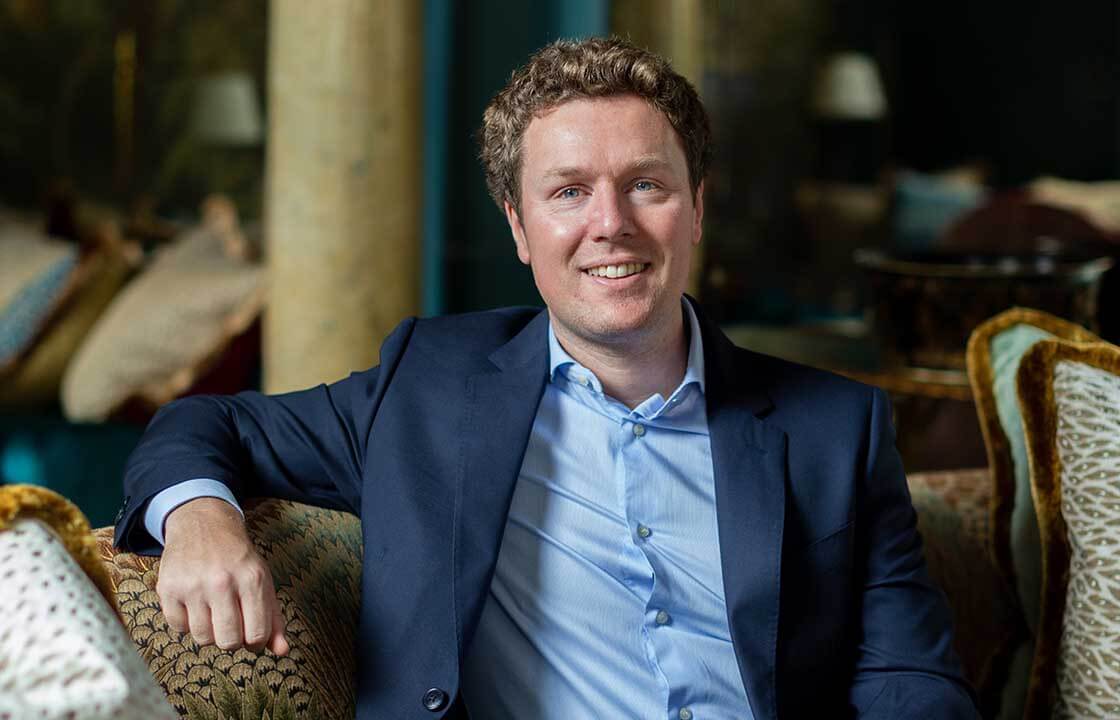 Jonathan Dunne smiling in his clinic in Belgravia