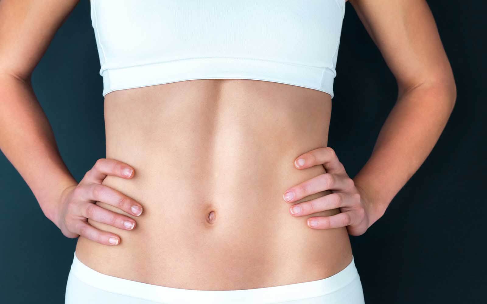 Womans stomach after a mini-abdominoplasty in Belgravia
