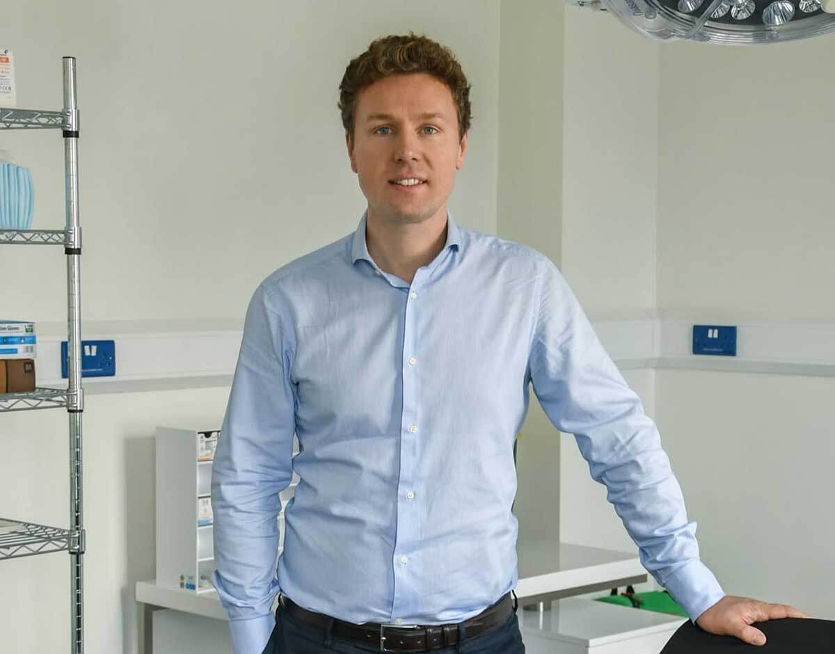 Jonathan Dunne smiling at a consultation