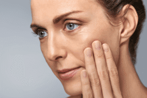 Woman after blepharoplasty surgery with Jonathan Dunne