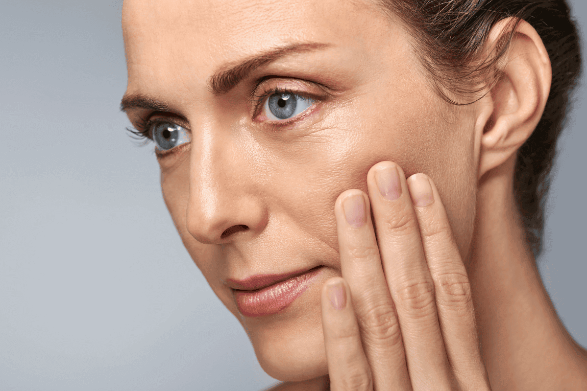 Woman after blepharoplasty surgery with Jonathan Dunne
