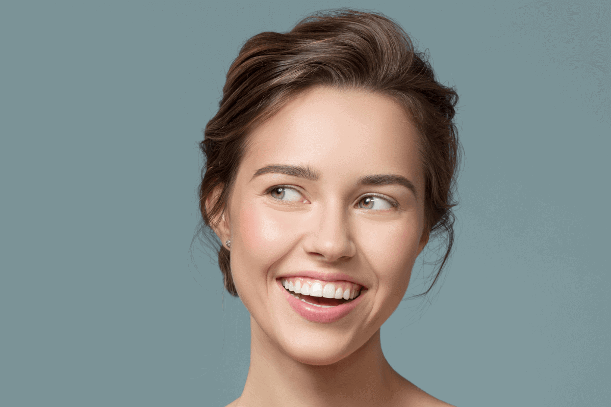 Woman smiling post surgery in Belgravia with Jonathan Dunne